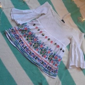 A very cute floraly shirt with bell sleeves